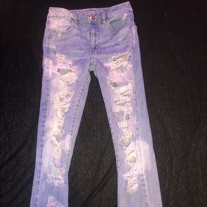 light wash super stretchy very ripped jeans